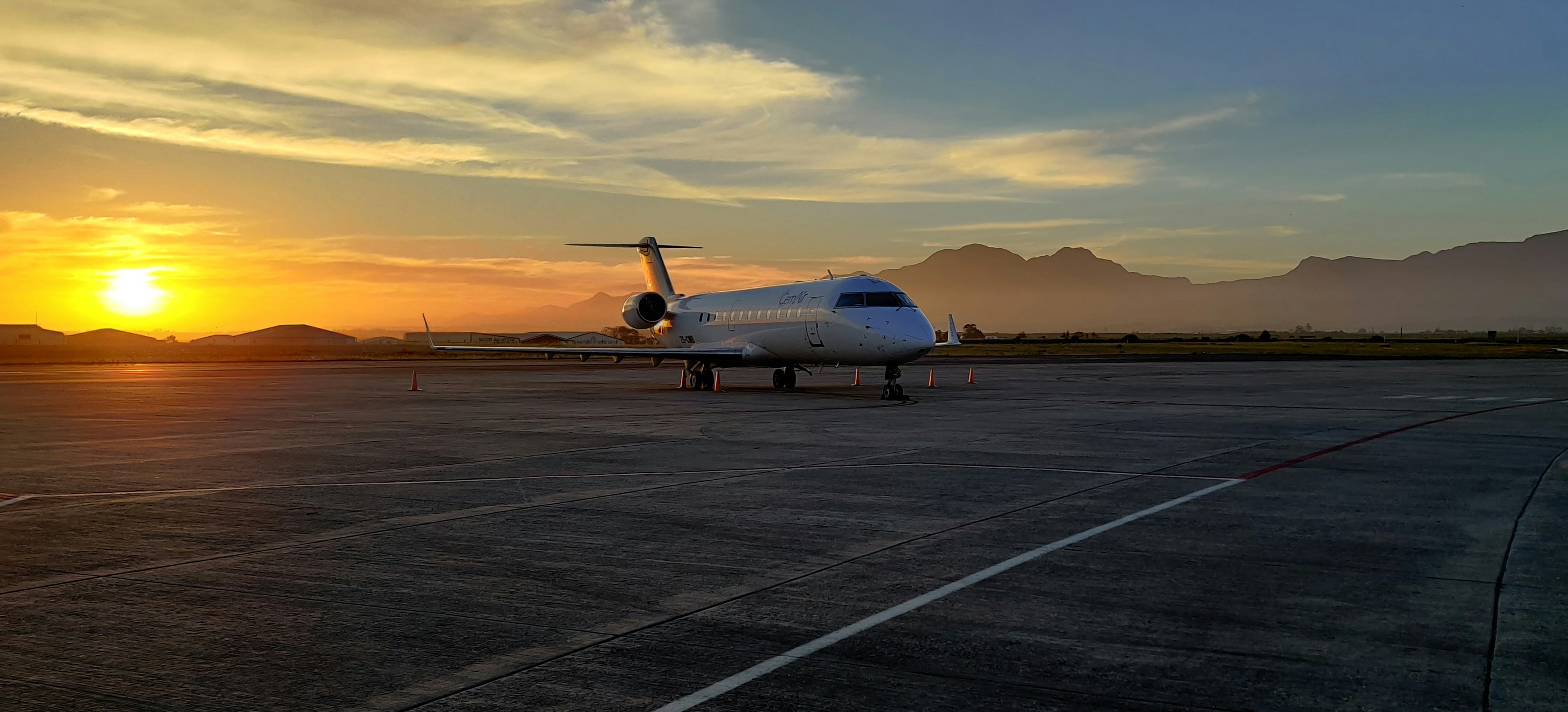 Private jet on the tarmac at sunrise, ready for departure in Africa